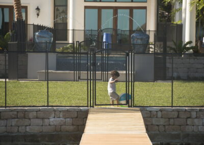 black pool fence arched gate